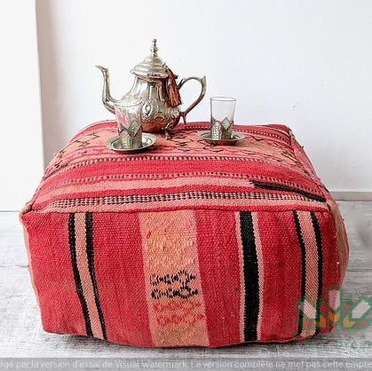 Kilim Moroccan poufs and ottomans made from rug and wool material, featuring vibrant patterns and traditional craftsmanship for stylish decor.