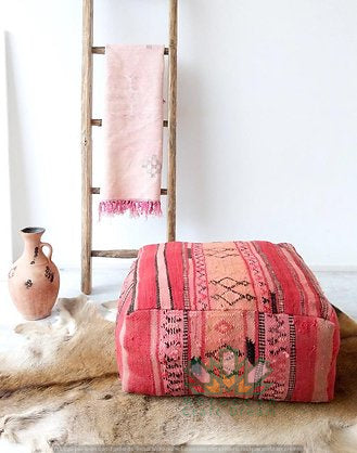 Kilim Moroccan poufs and ottomans made from rug and wool material, featuring vibrant patterns and traditional craftsmanship for stylish decor.