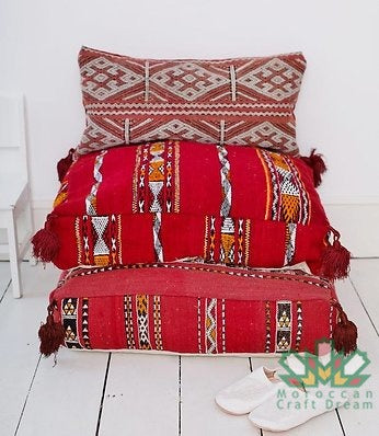 Kilim Moroccan poufs and ottomans made from rug and wool material, featuring vibrant patterns and traditional craftsmanship for stylish decor.