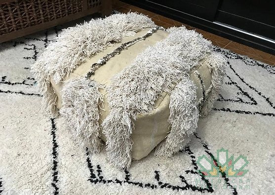 Kilim Moroccan poufs and ottomans made from rug and wool material, featuring vibrant patterns and traditional craftsmanship for stylish decor.