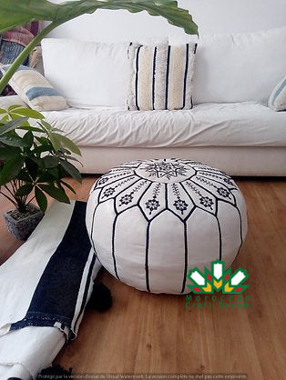 Handcrafted Moroccan leather poufs, ottomans and footstool in natural tones, featuring traditional stitching and soft, durable materials.