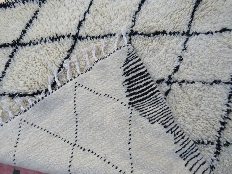 Berber area rugs and Moroccan carpets featuring traditional designs, handcrafted from high-quality materials for authentic home decor.
