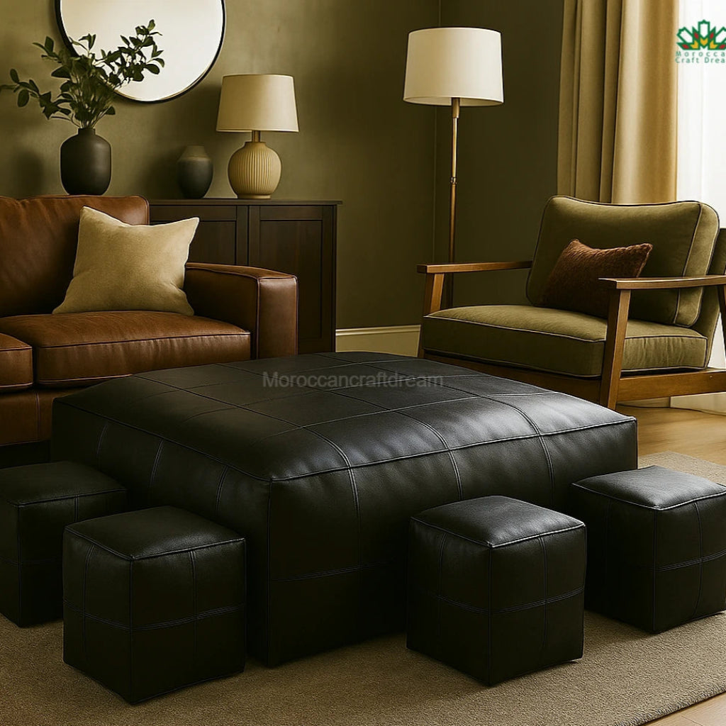 Living room with brown leather sofa, green armchair, and ottomans.