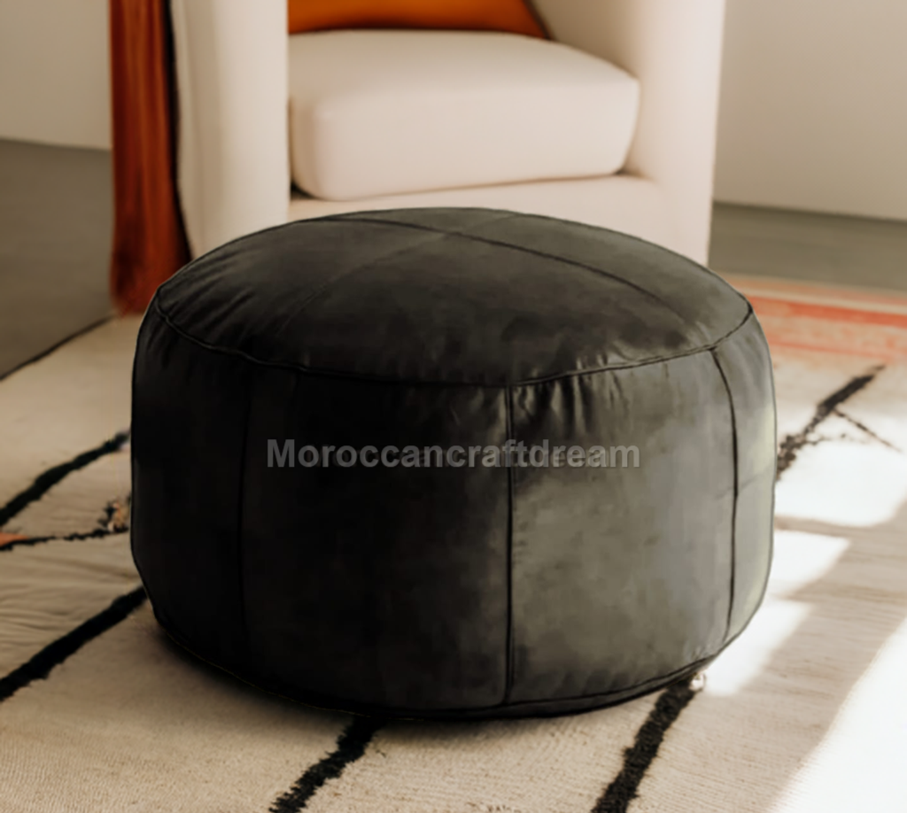 Handmade leather ottoman pouf used as footstool and coffee table