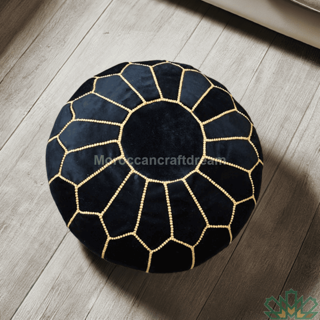 Black and gold geometric patterned pouf on a wooden floor
