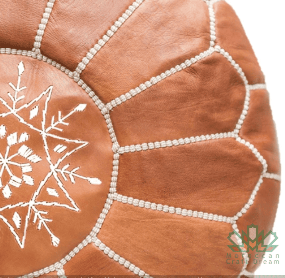 Genuine leather caramel Moroccan pouf ottoman, handcrafted with traditional techniques for a stylish addition to any space.