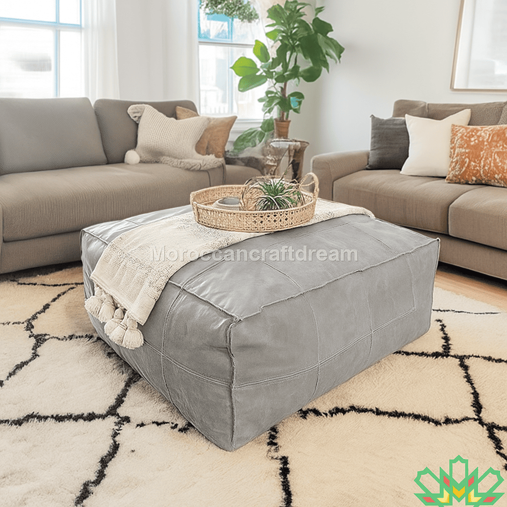 Gray ottoman with a woven basket on a patterned rug in a living room setting.