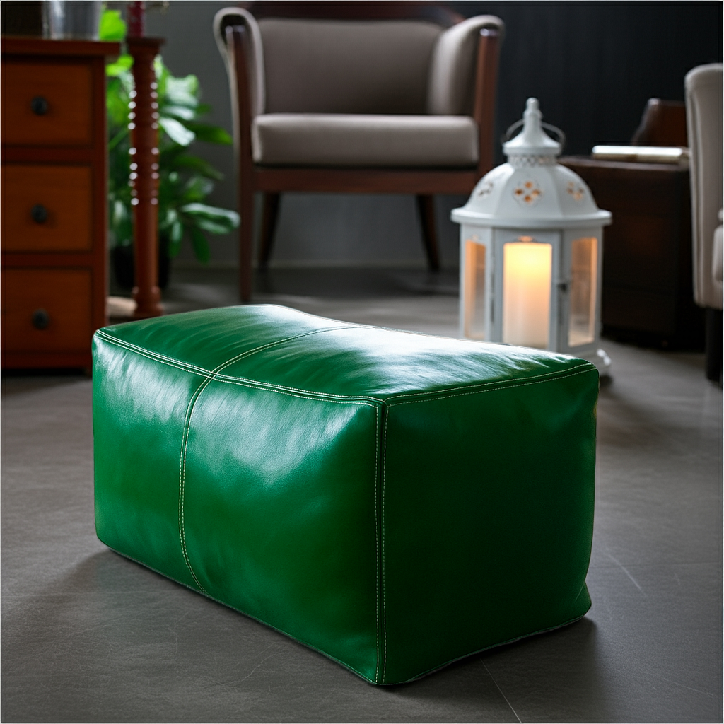 Green leather ottoman in a living room setting with a lantern and furniture.