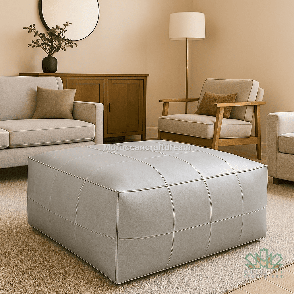 Pearl Gray ottoman in a living room setting with beige walls and furniture.