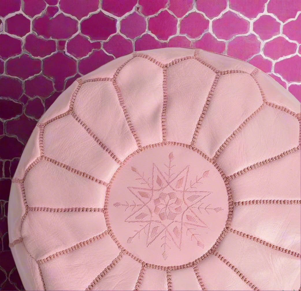 Elegant and functional Pink Moroccan leather pouf ottoman in a classic design, suitable for modern and traditional interiors.