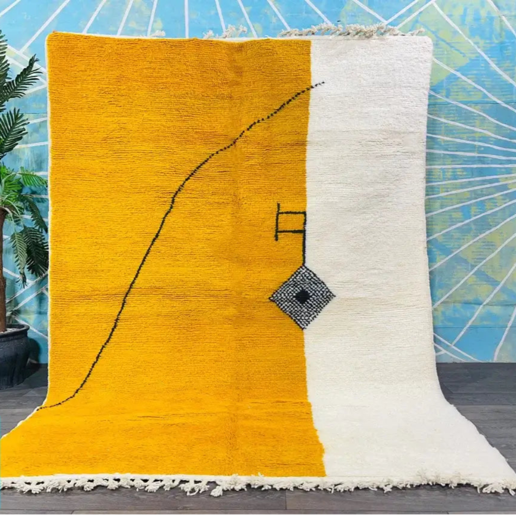 Berber yellow area rugs and Moroccan carpets featuring traditional designs, handcrafted from high-quality materials for authentic home decor.