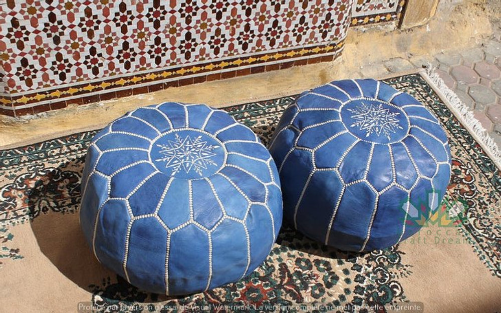 Handcrafted leather Moroccan poufs, ottomans and footstool in natural tones, featuring traditional stitching and soft, durable materials.