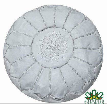 Handcrafted Moroccan leather poufs, ottomans and footstool in natural tones, featuring traditional stitching and soft, durable materials.