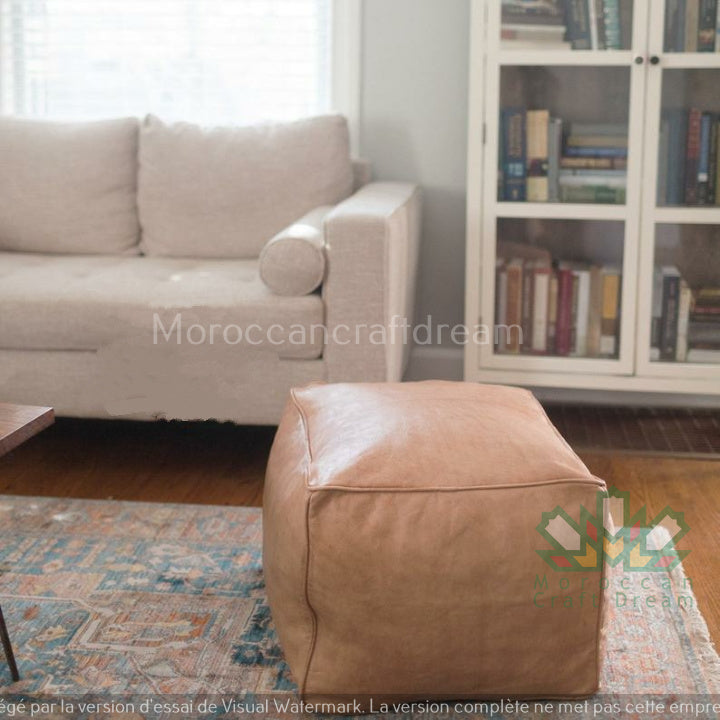 Handcrafted leather Moroccan poufs, ottomans and footstool in natural tones, featuring traditional stitching and soft, durable materials.