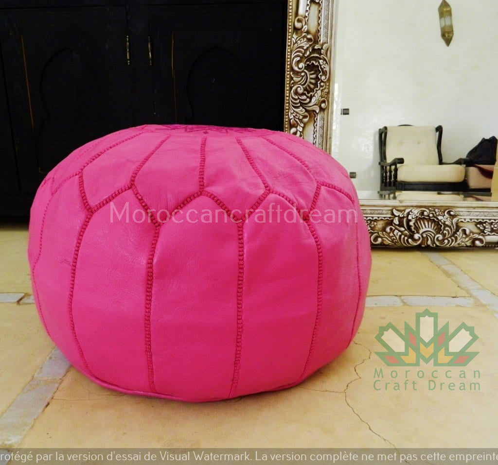 Handcrafted Moroccan leather poufs, ottomans and footstool in natural tones, featuring traditional stitching and soft, durable materials.