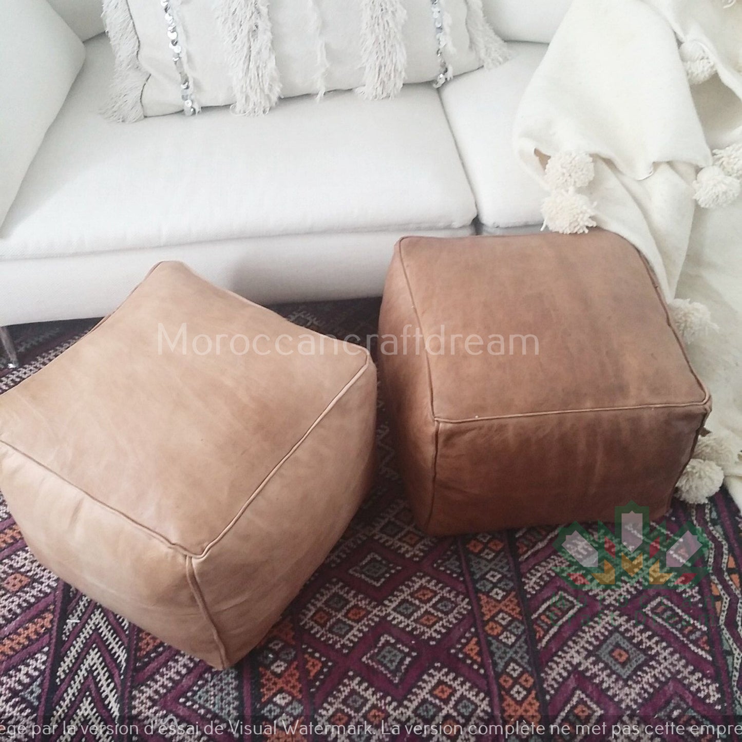 Handcrafted leather Moroccan poufs, ottomans and footstool in natural tones, featuring traditional stitching and soft, durable materials.