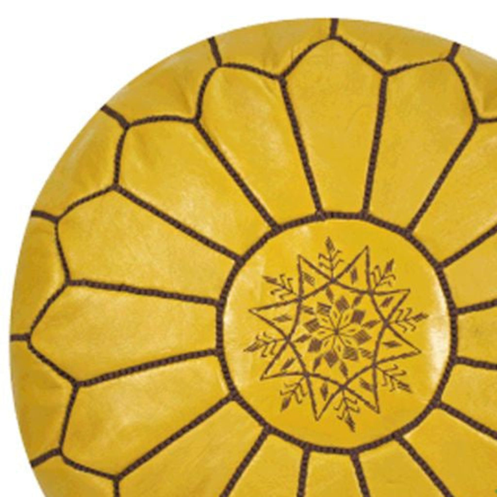 Handcrafted Moroccan leather poufs, ottomans and footstool in natural tones, featuring traditional stitching and soft, durable materials.