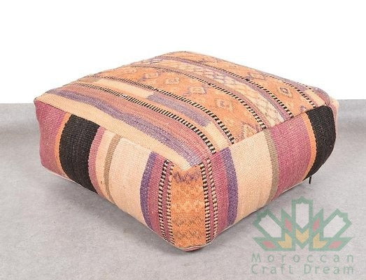 Kilim Moroccan poufs and ottomans made from rug and wool material, featuring vibrant patterns and traditional craftsmanship for stylish decor.