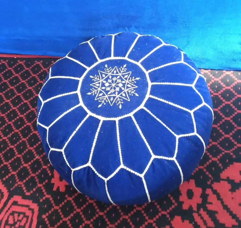Moroccan poufs and ottomans footstool used as a coffee table, handcrafted in wool and velvet with traditional stitching and durable design