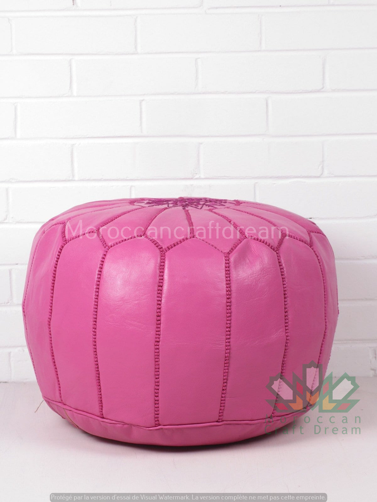 Handcrafted Moroccan leather poufs, ottomans and footstool in natural tones, featuring traditional stitching and soft, durable materials.