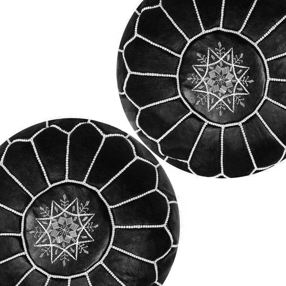 Black handmade round Moroccan pouf ottoman in genuine leather, perfect for use as a versatile coffee table or footrest. This Moroccan leather ottoman enhances living room decor with its elegant design and multifunctional use. Crafted from high-quality leather, Moroccancraftdream's leather poufs offer a stylish and practical solution for modern living spaces. Ideal for use as a coffee table or seating, this round pouf adds a touch of sophistication to any room