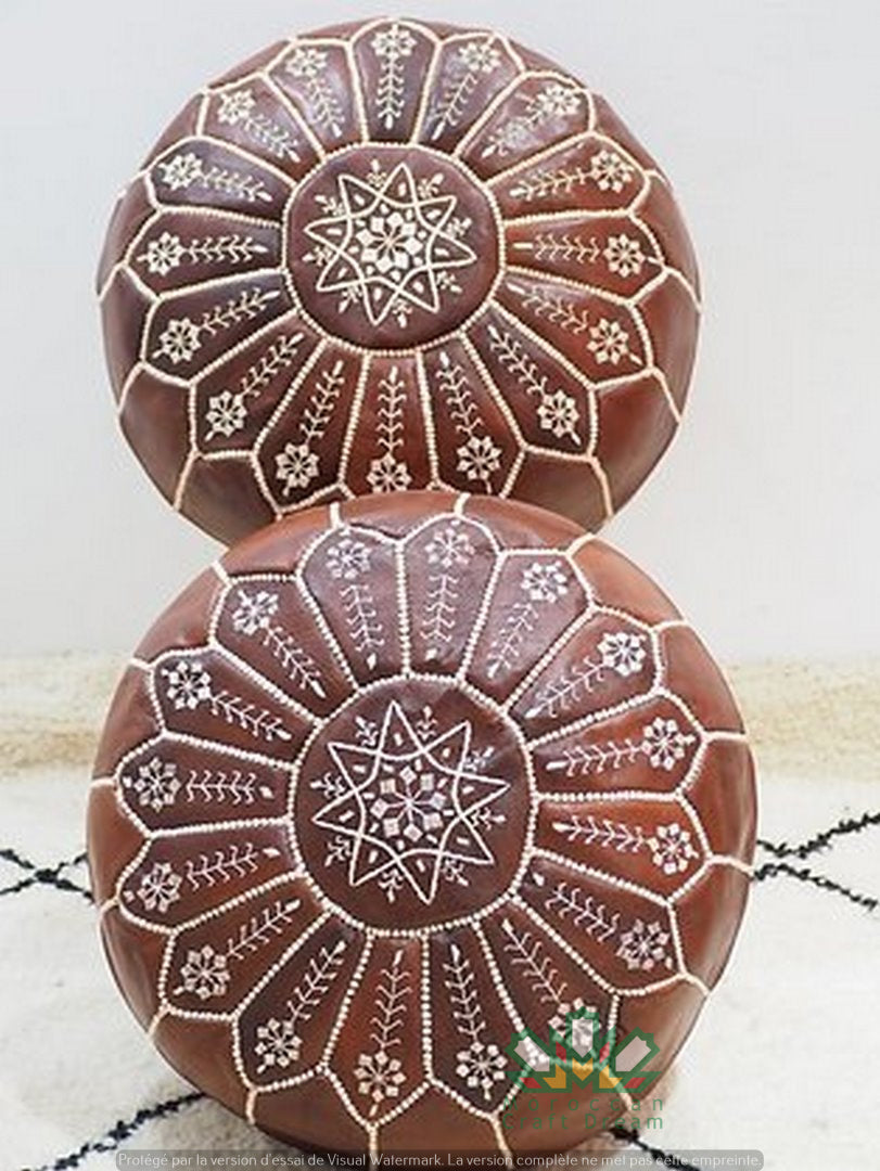 Handcrafted Moroccan leather poufs, ottomans and footstool in natural tones, featuring traditional stitching and soft, durable materials.