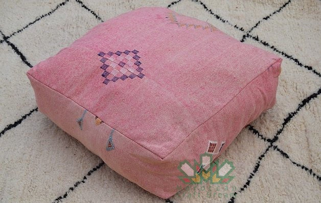 Kilim Moroccan poufs and ottomans made from rug and wool material, featuring vibrant patterns and traditional craftsmanship for stylish decor.