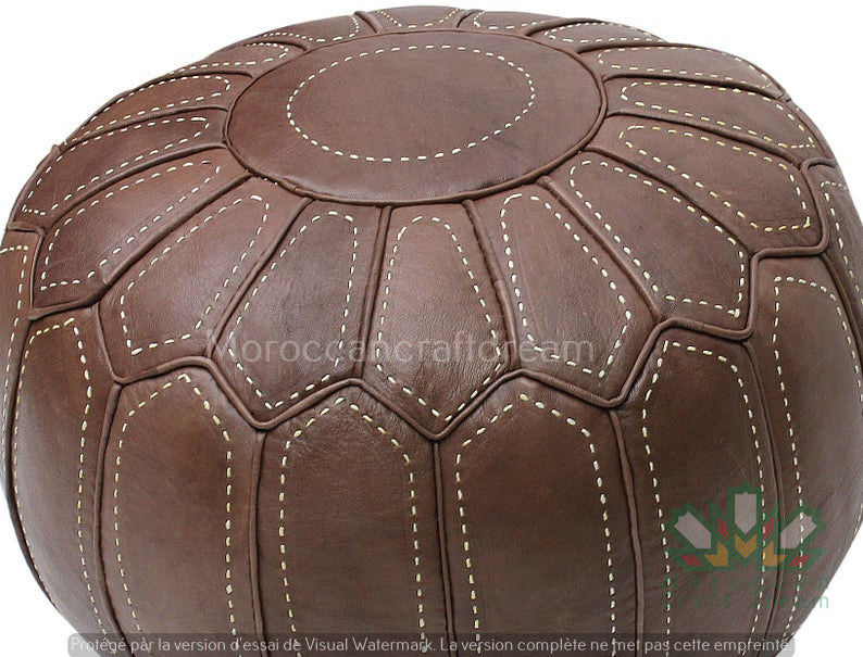 Handcrafted Moroccan leather poufs, ottomans and footstool in natural tones, featuring traditional stitching and soft, durable materials.