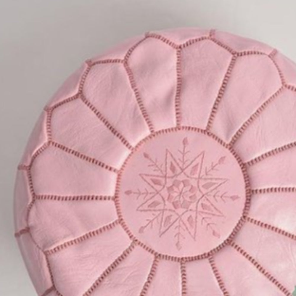 Handcrafted leather Moroccan poufs, ottomans and footstool in natural tones, featuring traditional stitching and soft, durable materials.