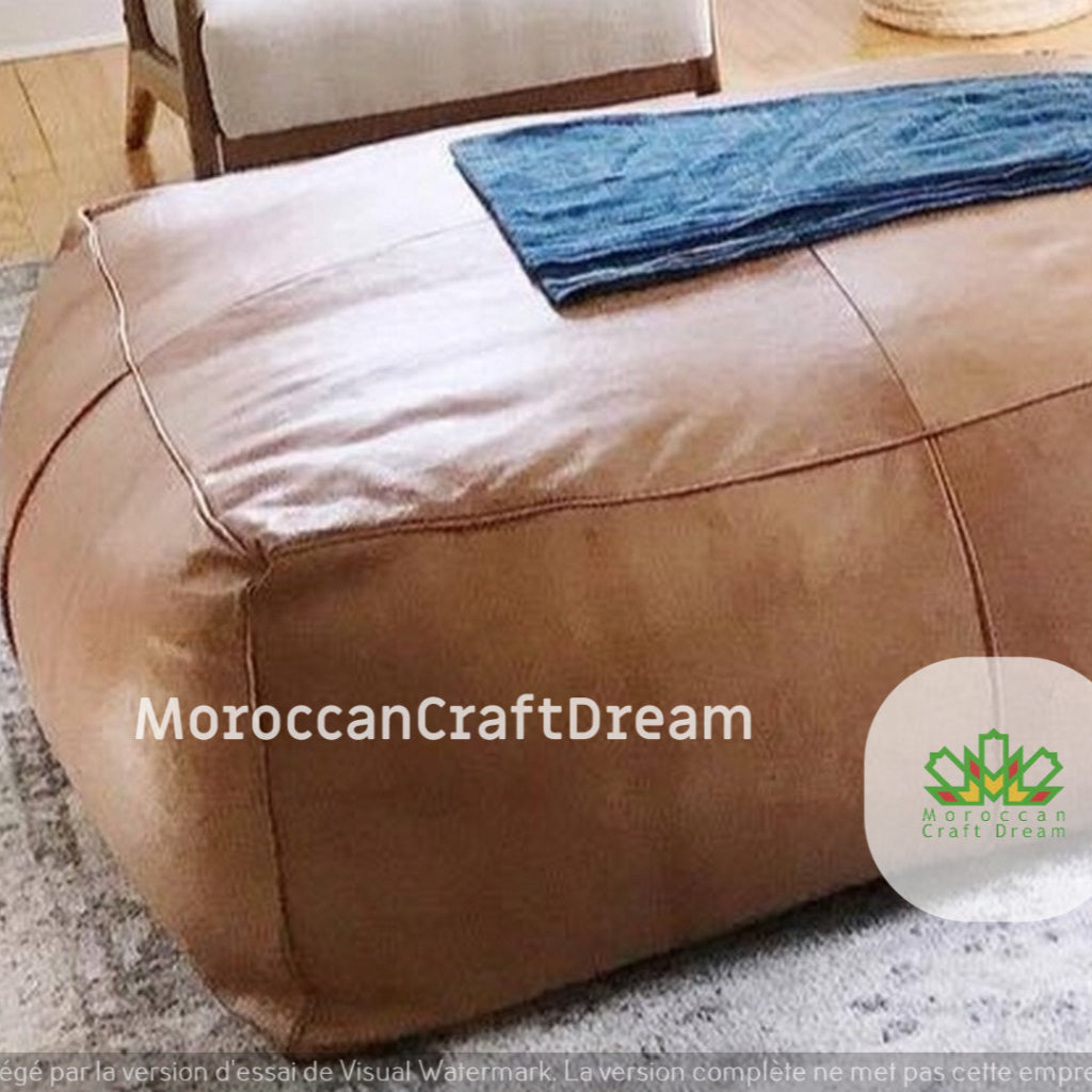 Large light caramel simpy coffee table ottoman, adding style and versatility to spacious living rooms with a luxurious touch.