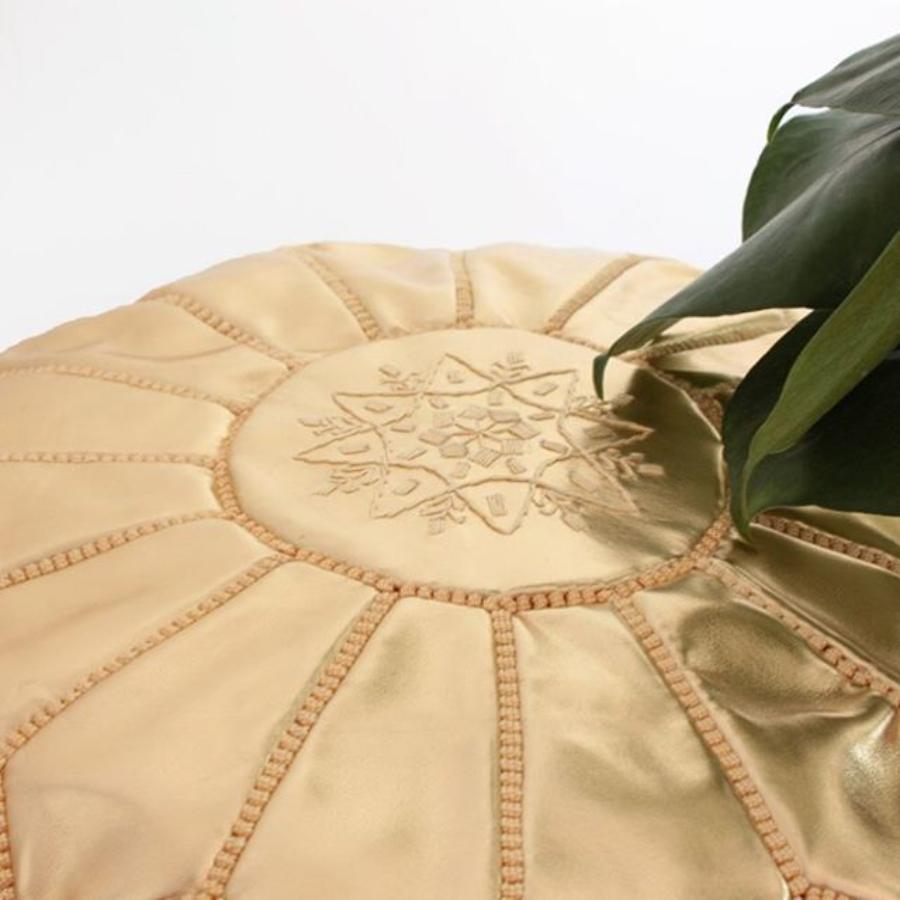 Elegant Gold Moroccan leather ottoman designed to add a touch of sophistication and versatility to any room