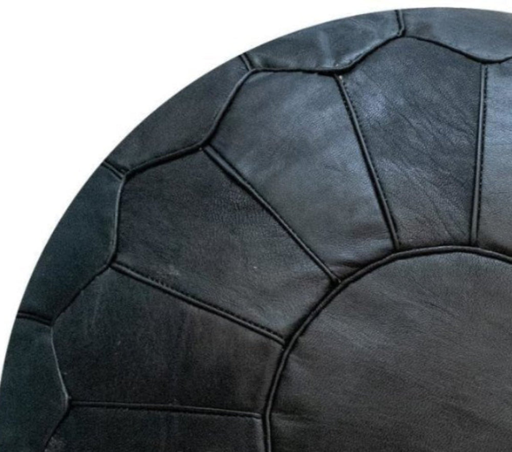 Black Luxury Moroccan leather ottoman for living room decor, blending functionality with authentic Moroccan style.