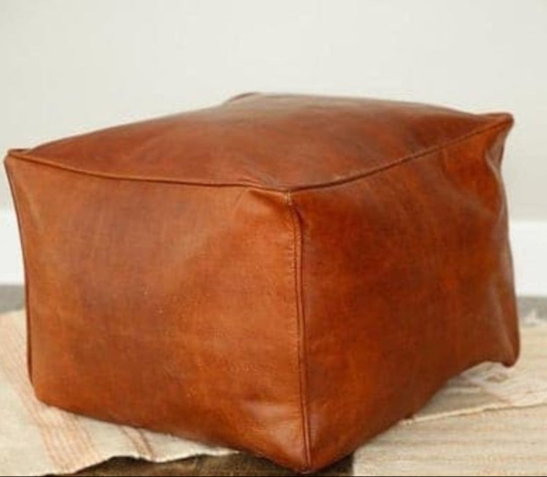 Handmade leather ottoman, Moroccan poufs, ottomans and footstool in natural tones, featuring traditional stitching and soft, durable materials.