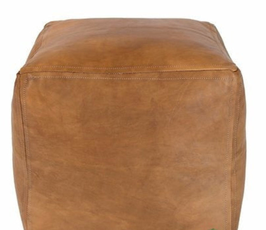Handcrafted Moroccan leather poufs, ottomans and footstool in natural tones, featuring traditional stitching and soft, durable materials.