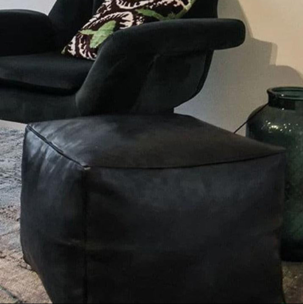 Handcrafted leather Moroccan poufs, ottomans and footstool in natural tones, featuring traditional stitching and soft, durable materials.