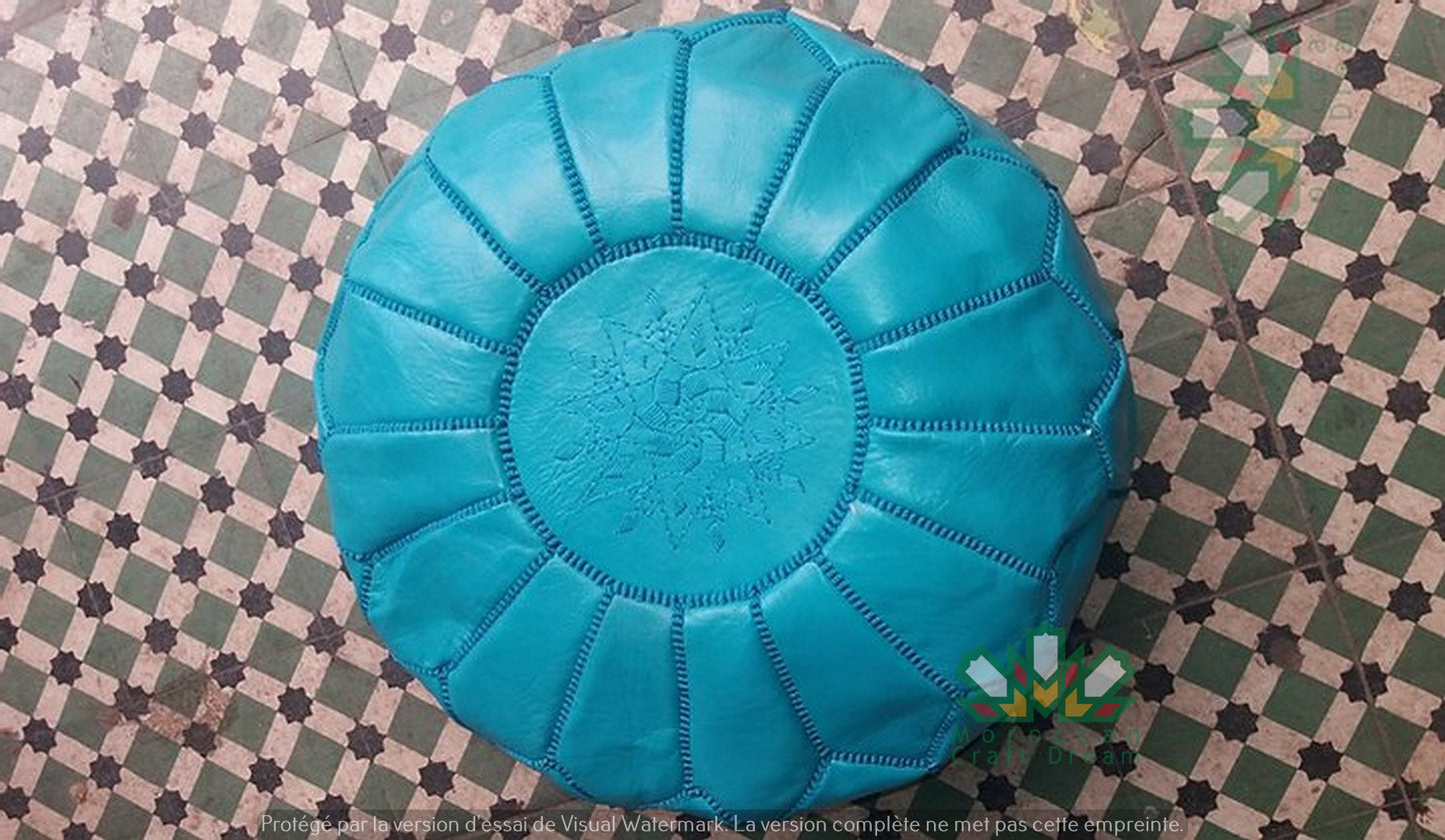 Handcrafted Moroccan leather poufs, ottomans and footstool in natural tones, featuring traditional stitching and soft, durable materials.