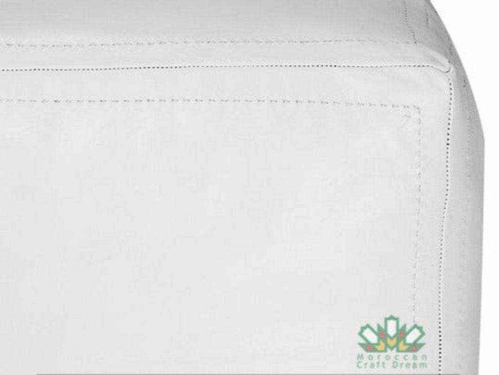 Handmade white leather Moroccan poufs, ottomans and footstool in natural tones, featuring traditional stitching and soft, durable materials.