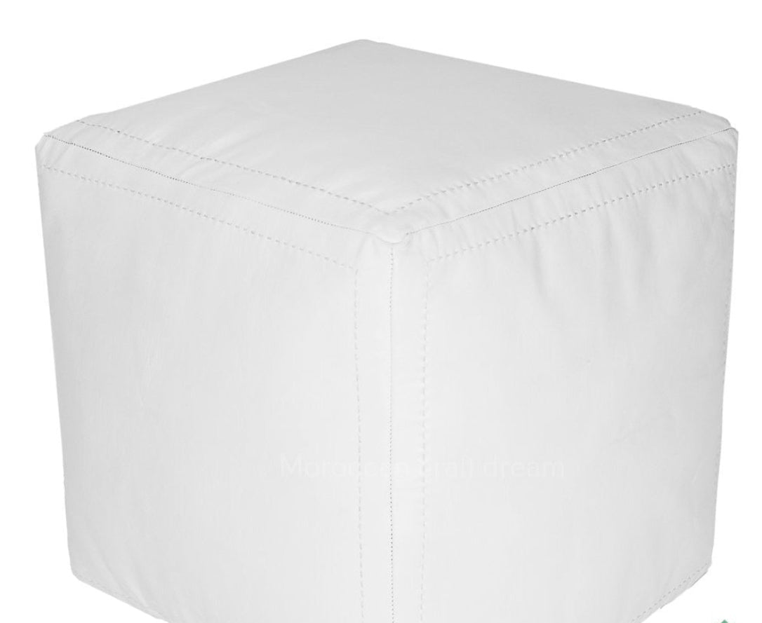 Handcrafted white leather Moroccan poufs, ottomans and footstool in natural tones, featuring traditional stitching and soft, durable materials.