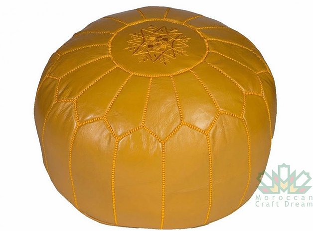 Handcrafted Moroccan leather poufs, ottomans and footstool in natural tones, featuring traditional stitching and soft, durable materials.