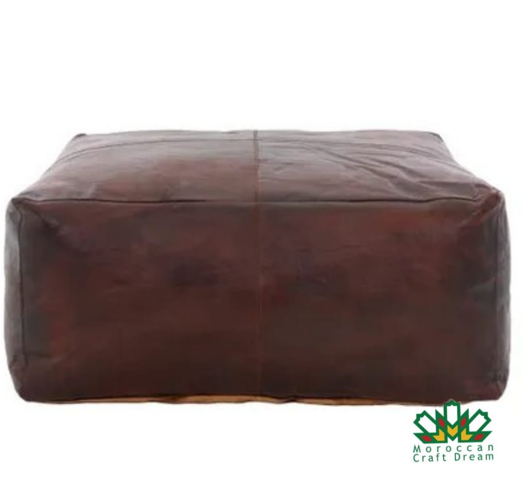 Square and rectangular Moroccan leather poufs used as coffee table ottomans, handcrafted with traditional stitching and durable materials