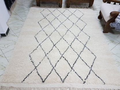 Berber area rugs and Moroccan carpets featuring traditional designs, handcrafted from high-quality materials for authentic home decor.