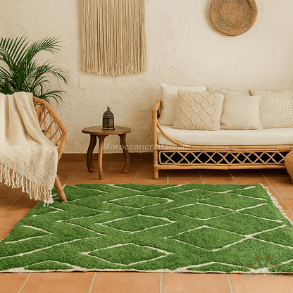 Green geometric patterned rug in a living room with a couch, table, and plant.