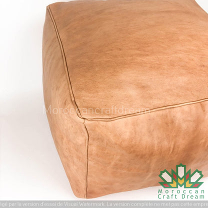 Square and rectangular Moroccan light caramel natural Unique Moroccan leather pouf, designed for a lounge decor that combines comfort and elegance.