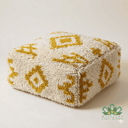 Beige ottoman with yellow geometric patterns on a white background