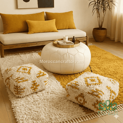 Living room with wooden sofa, ottomans, and a round coffee table on a yellow rug.