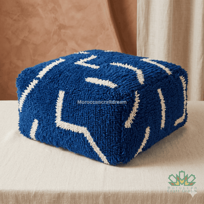 Blue cushion with white patterns on a white background