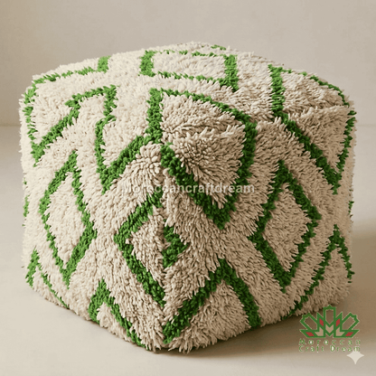Cube-shaped ottoman with green and beige pattern on a white background