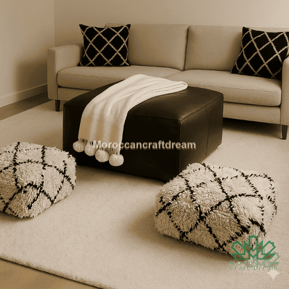 Living room with beige sofa, black ottoman, and patterned cushions.