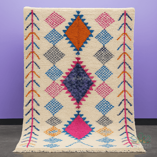 Colorful geometric patterned rug on a purple background