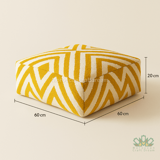 Yellow and white patterned ottoman with dimensions on a beige background